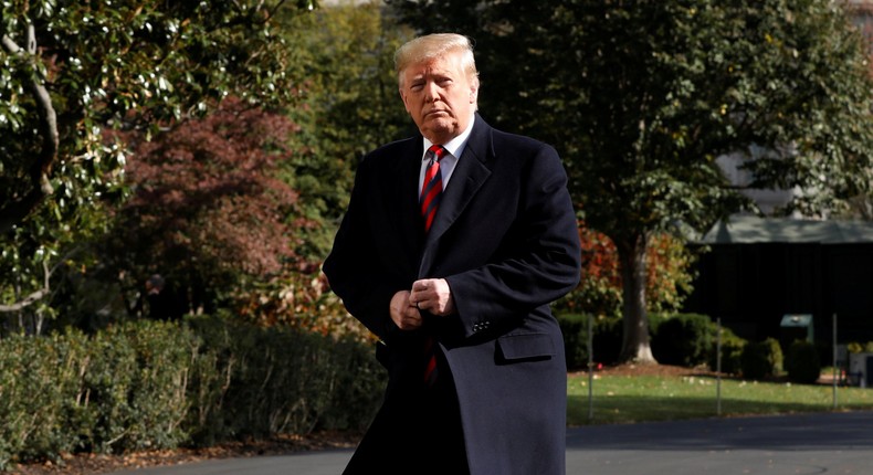 FILE PHOTO: U.S. President Donald Trump looks at the media on the South Lawn of the White House in Washington, U.S., before their departure to Alabama and New York, November 9, 2019. REUTERS/Yuri Gripas