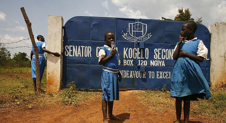 (FILE IMAGE) KOGELO, KENYA - FEBRUARY 05: Kenyan school students stand outside gates to their school; the Senator Obama Kogelo Secondary school, on February 5, 2008 in Kogelo, Kenya. (Photo Paula Bronstein/Getty Images)