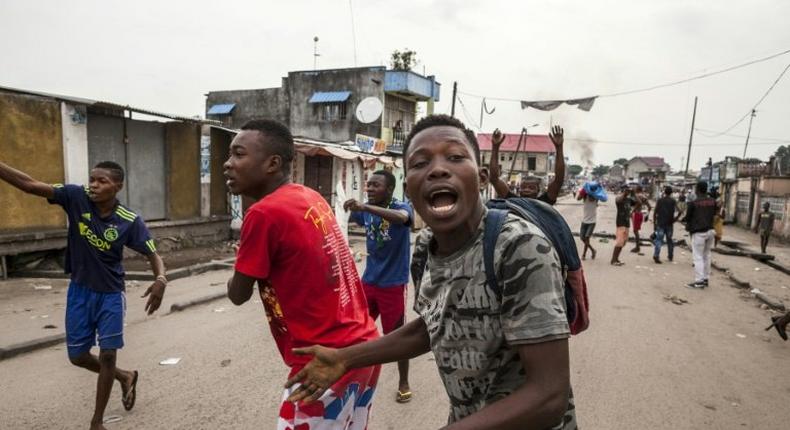 People protest in the neighbourhood of Yolo in Kinshasa on December 20, 2016 after the opposition leader called on citizens to reject President Joseph Kabila whose mandate expired on December 20