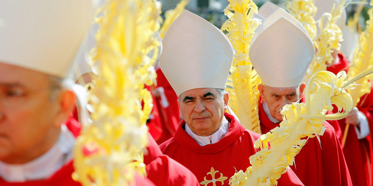 Cardinal Angelo Becciu arrives for the Palm Sunday Mass led by Pope Francis in Saint Peter's Square, at the Vatican