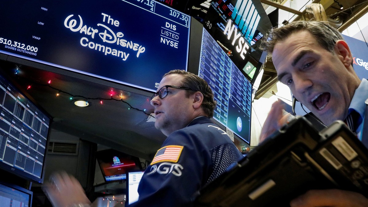 Traders work at the post where Walt Disney Co. stock is traded on the floor of the NYSE in New York