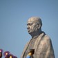 Police officers stand near the Statue of Unity portraying Sardar Vallabhbhai Patel, one of the fou