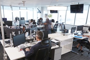 Interior Of Busy Modern Open Plan Office With Staff