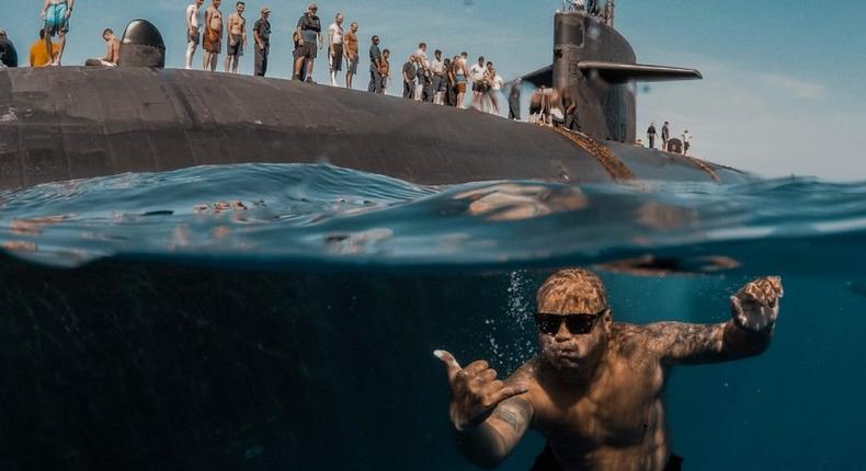 Sailors assigned to Los Angeles-class fast-attack submarine USS Olympia (SSN 717) participate in a swim call at sea