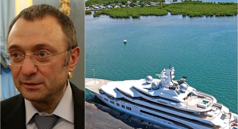 Suleyman Kerimov next to picture of his $300 million superyacht that is docked in Fiji.