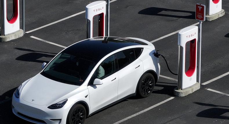 A Tesla car charging up at a Tesla Supercharger.Justin Sullivan via Getty Images