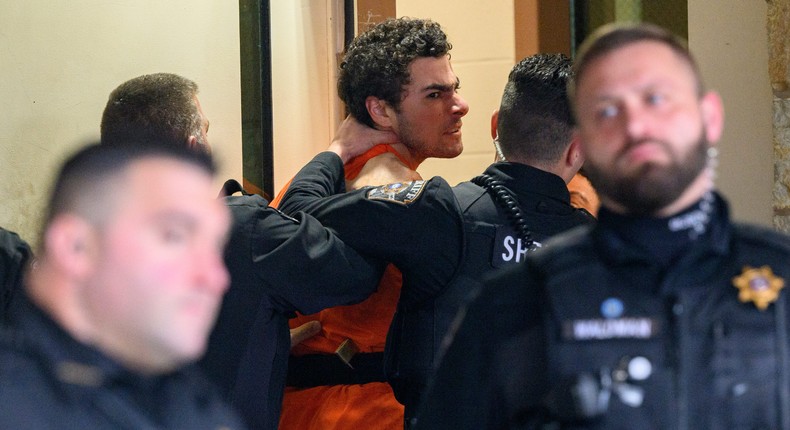 Luigi Mangione yelled to the press as he was led into a Pennsylvania courthouse.Jeff Swensen/Getty Images