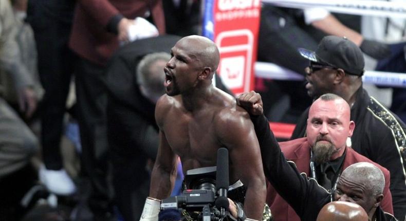 Mayweather heads into retirement with a record 50th straight victory