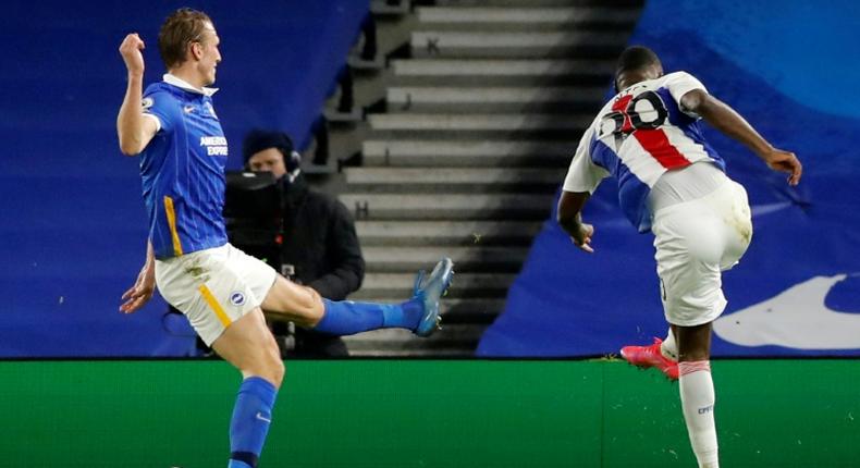 Benteke brilliance: Christian Benteke (right) snatched a 2-1 win for Crystal Palace away to Brighton on Monday