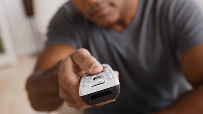 A man holding a remote control