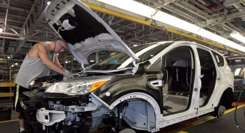 FILE PHOTO: File photo of Louisville Assembly Plant employees assembling the 2013 Ford Escape on the production line in Louisville