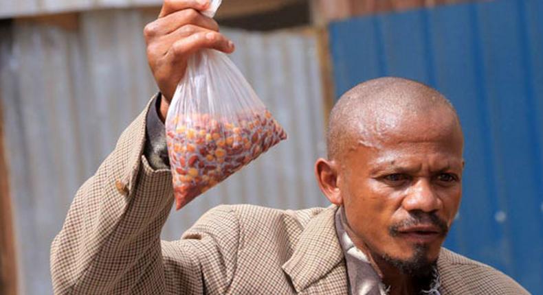 Kenya's githeri man holding his githeri (Courtesy)