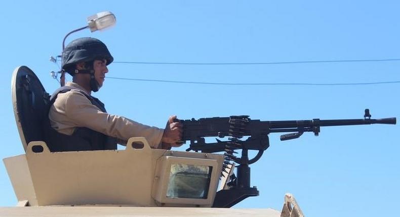 An Egyptian army soldier looks on from his postion at a checkpoint in Al Arish city, in the troubled northern part of the Sinai peninsula, July 8, 2015.        REUTERS/Stringer