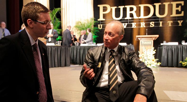 Indiana Gov. Mitch Daniels speaks to a student after being named as the next president of Purdue University.