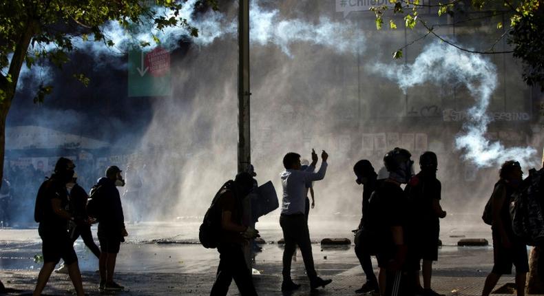 Police used water cannon and tear gas to disperse demonstrators in Chile's capital Santiago