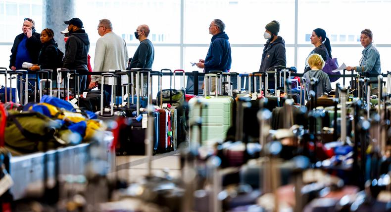Travelers wait in line at Denver International Airport, the world's sixth busiest airport.Michael Ciaglo/Getty