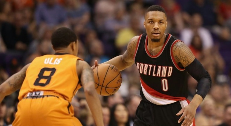 Portland led by 23 points just 10 minutes into the game against Atlanta and rolled to victory behind 27 points from Damian Lillard (R) and 22 from fellow guard CJ McCollum