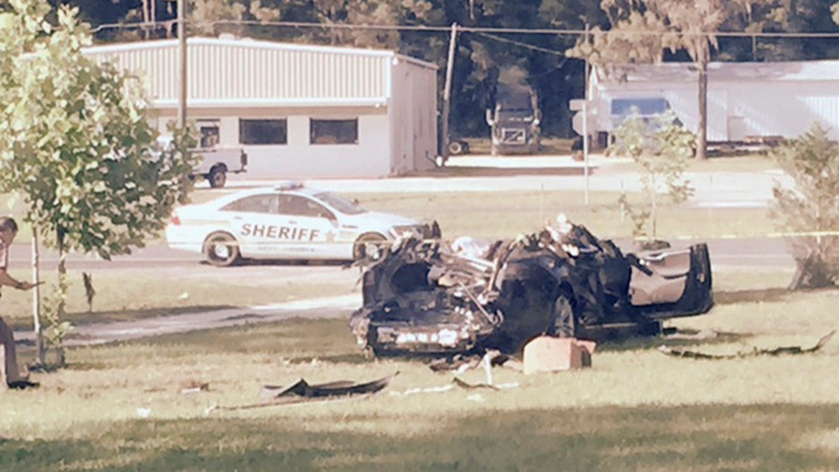 A Tesla Model S involved in the fatal crash on is shown with the top third of the car sheared off by