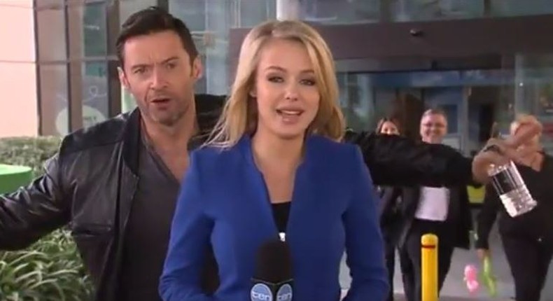 Hugh Jackman photo-bombing a news reporter 