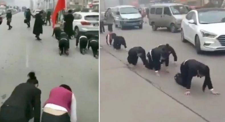Company makes employees crawl through the streets for failing to meet sales targets (Video)