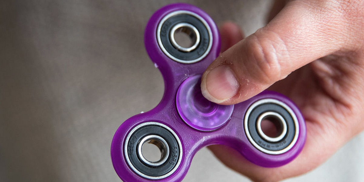 YouTubers are drilling holes in iPhones to turn them into $5 fidget spinners