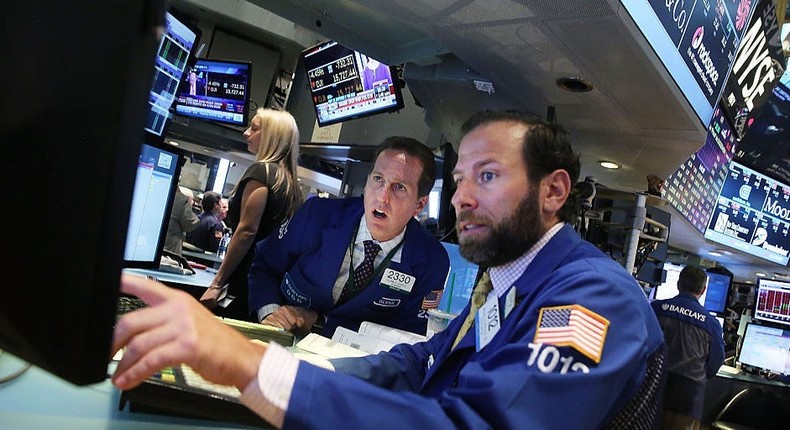 Traders work on the floor of the New York Stock Exchange (NYSE)