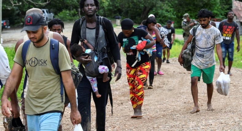 Haitian migrants arrive in Lajas Blancas, Darien province, Panama, on May 22, 2019, after walking through the jungle