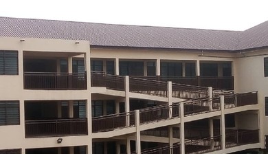 Abandoned classroom building rots as pupils learn in wooden structure at Osu Presby