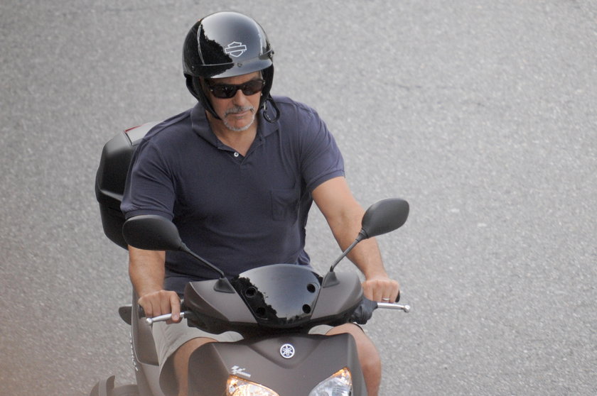 EXCLUSIVE: George Clooney takes a relaxing scooter ride around Lake Como, leaving wife Amal at home 