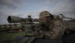 A sniper from the 108th Territorial Defense Brigade of the Ukrainian Army takes aim during military training near the frontline in Ukraine in November 2023.Ozge Elif Kizil/Anadolu via Getty Images