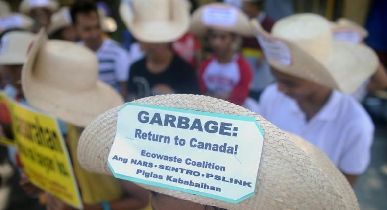 Environmental activists rallying outside the Philippine Senate in Manila in 2015 to demand that scores of containers filled with household rubbish be shipped back to Canada