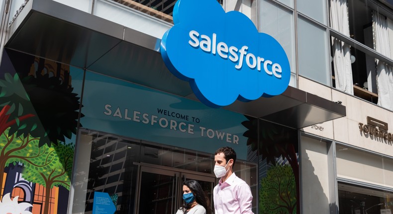 People wear protective face masks outside Salesforce Tower.