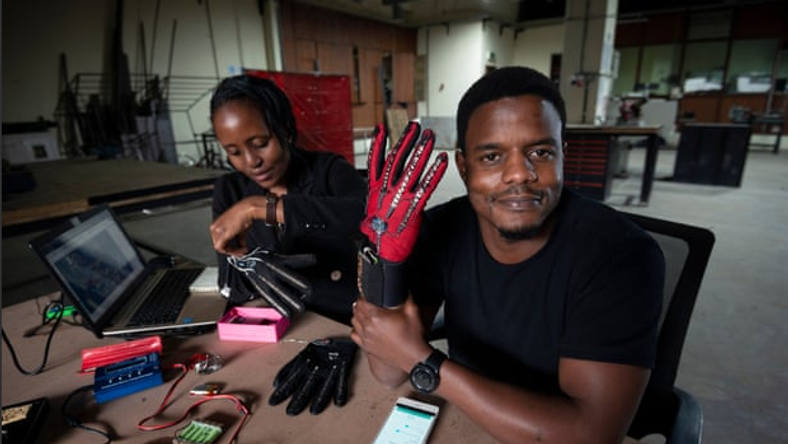 Roy Allela tries out his smart gloves