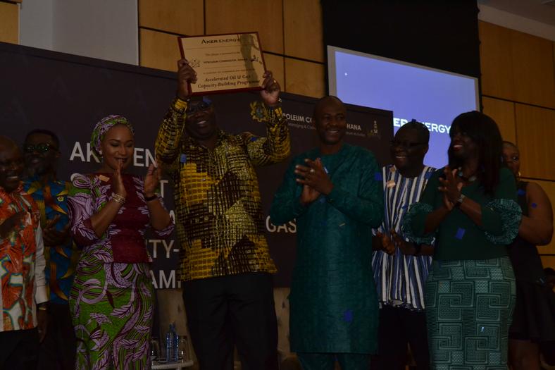 Mr. Egbert Faibille Jnr. Acting CEO of Petroleum Commission displays the plaque symbolising the commencement of Aker Energy’s support for the AOGC Programme  