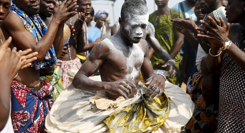 A devotee is cheered as he dances at the annual voodoo festival in Ouidah January 10, 2016. REUTERS/Akintunde Akinleye