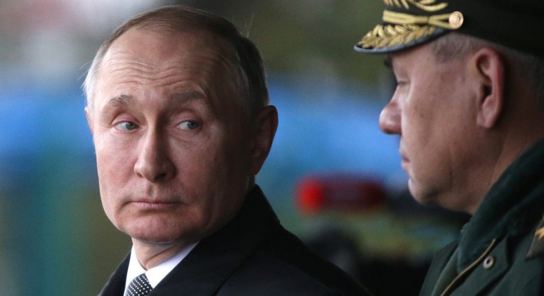 Russian President Vladimir Putin (L) looks on Defence Minister Sergei Shoigu (R) during a military parade in Pskov, Russia, on March,1, 2020.Mikhail Svetlov/Getty Images