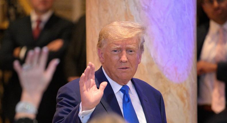 Former President Donald Trump, left, waves to guests during an election night party at Mar-a-Lago, Tuesday, November 8, 2022 in Palm Beach, Florida.Phelan M. Ebenhack for The Washington Post via Getty Images
