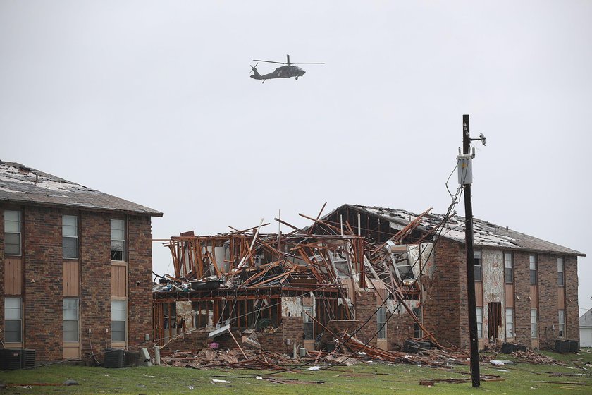 A man, who lost his home to Hurricane Harvey, is loaded into the back of an ambulance in Rockport, T