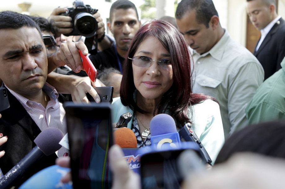 Cilia Flores, center, deputy of Venezuela's United Socialist Party (PSUV) and wife of Venezuela's President Nicolas Maduro, talks to the media after a failed session of the National Assembly for lack of quorum in Caracas, January 12, 2016.