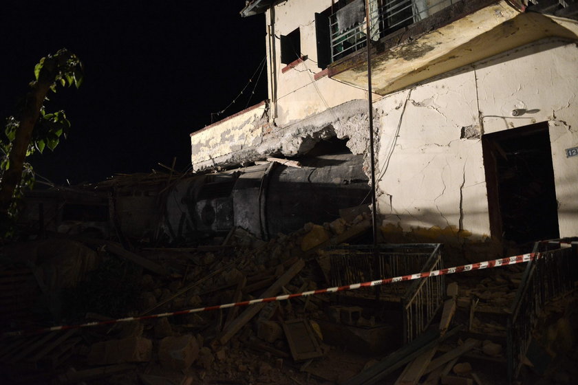 A derailed train carriage is seen toppled in the town of Adendro in northern Greece