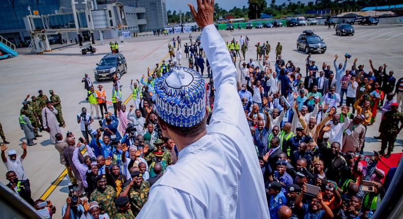 President Muhammadu Buhari waves at a crowd of supporters in Port Harcourt, Rivers State on October 25, 2018