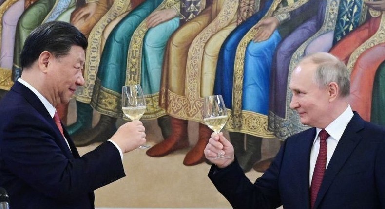 Russian President Vladimir Putin and China's President Xi Jinping make a toast during a reception following their talks at the Kremlin in Moscow on March 21, 2023.PAVEL BYRKIN/SPUTNIK/AFP via Getty Images