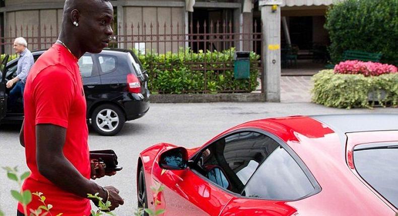 Balotelli pictured with his Ferrari F12 Berlinetta