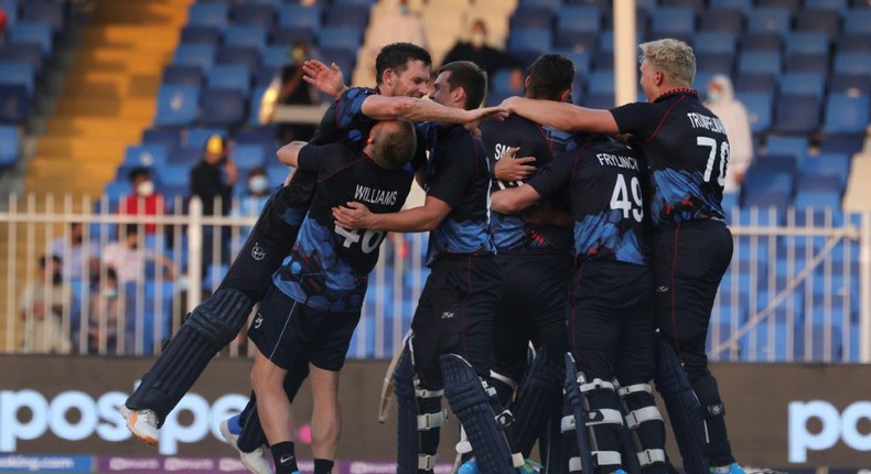 Moment of history: Namibia's cricketers celebrate their victory Creator: Karim SAHIB