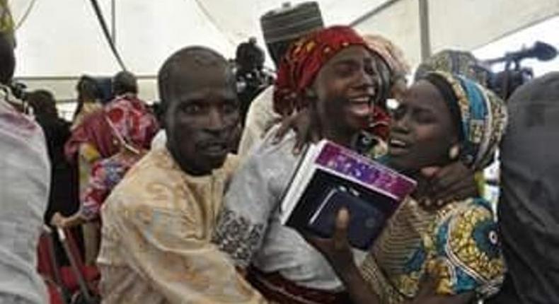 Released Chibok girls reunite with families in Abuja amidst tears 