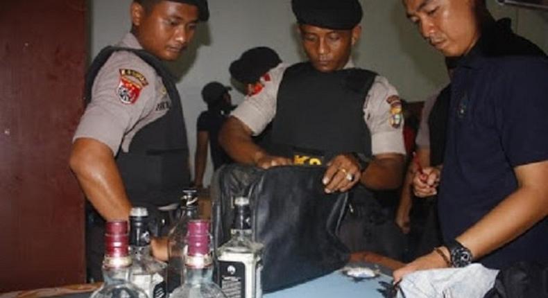Indonesian Narcotic officials displaying the drugs got from the dead suspect