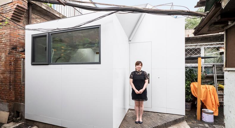 Mrs. Fan and her Plug-in House in Changchun Jie, China.