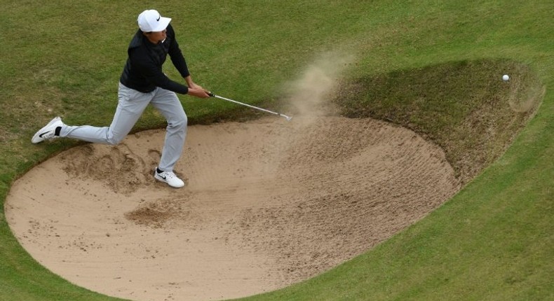 China's Li Haotong fails to get out of a bunker on the 12th hole on July 21, 2017