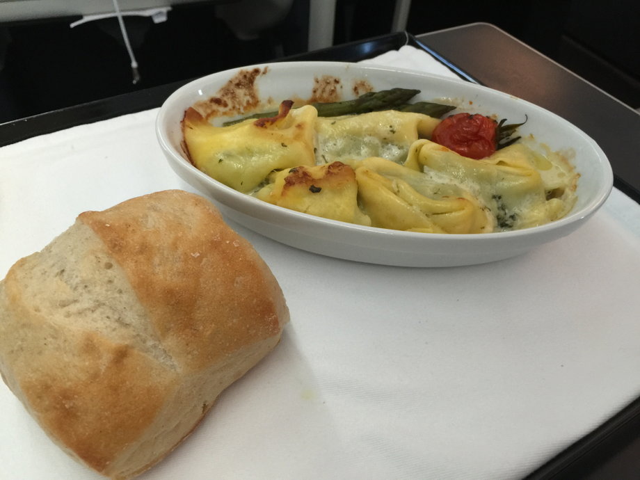 About an hour later, we were served dinner. Passengers had a choice of chicken in a red wine sauce, or spinach and cheese tortellini served with warm bread. I went with the pasta. It was simple yet flavorful. And the portion sizes were perfect.