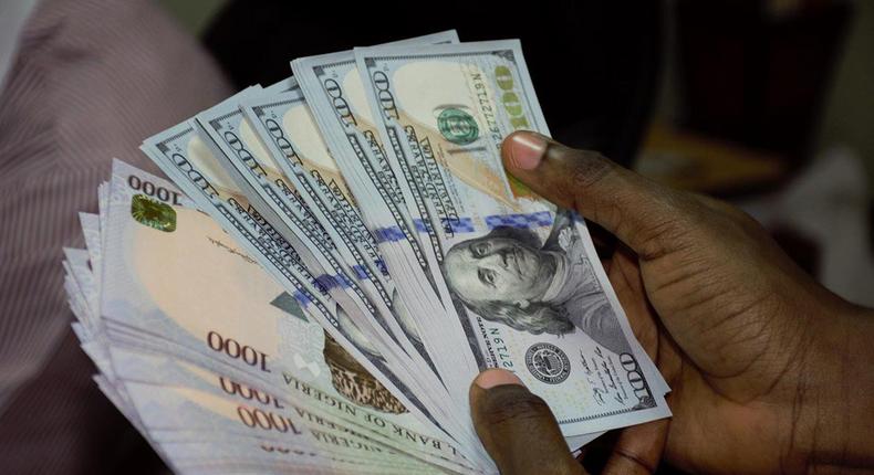 Naira appreciates against dollar, exchanges at 420.12.